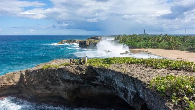 From San Juan: Cave of the Taino Indian Trek and Beach Tour