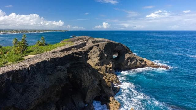 From San Juan: Cave of the Taino Indian Trek and Beach Tour