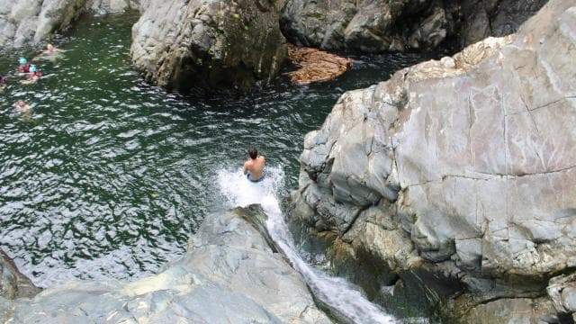 From San Juan: El Yunque Waterslide with Transportation