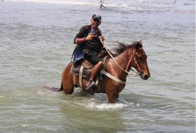 Beach horse back riding with countryside